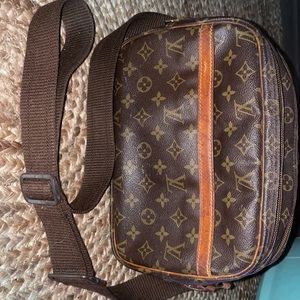 Louis Vuitton authentic crossbody with photography like strap.